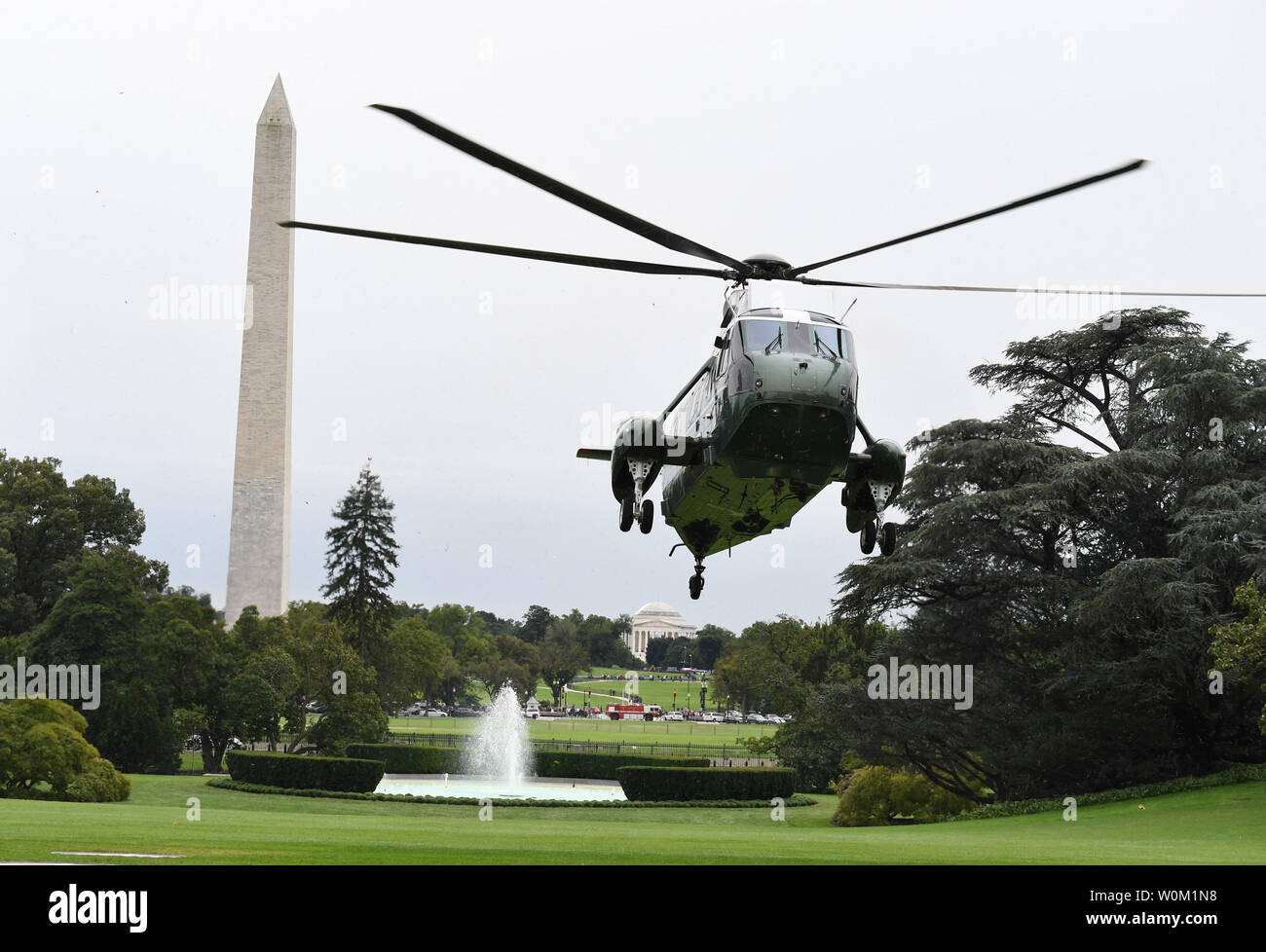 Marine One with President Donald Trump aboard lands on the South Lawn of the White House in Washington, DC on September 27, 2018.   The president is returning from New York and the United Nations.  The Washington Monument is at left.  Photo by Pat Benic/UPI Stock Photo