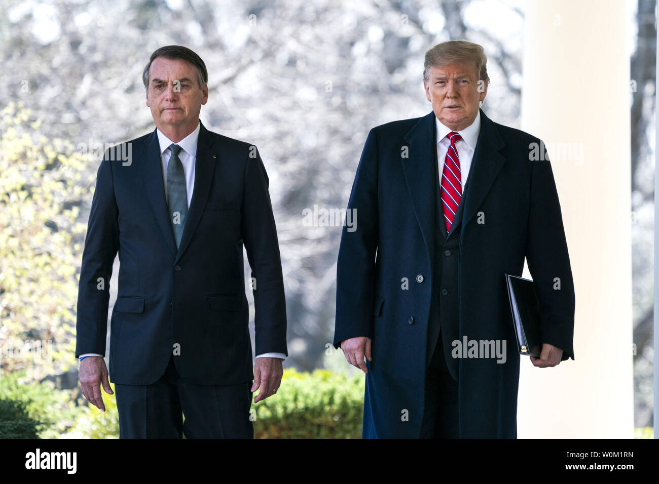 President Donald Trump walks with Brazilian President Jair Bolsonaro along the West Colonnade before their joint press conference in the Rose Garden of the Washington, DC on March 19, 2019.     Photo by Jim Lo Scalzo/UPI Stock Photo
