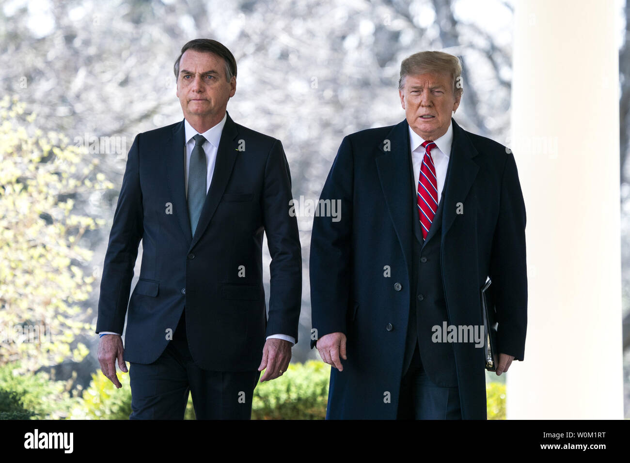 President Donald Trump walks with Brazilian President Jair Bolsonaro along the West Colonnade before their joint press conference in the Rose Garden of the Washington, DC on March 19, 2019.     Photo by Jim Lo Scalzo/UPI Stock Photo