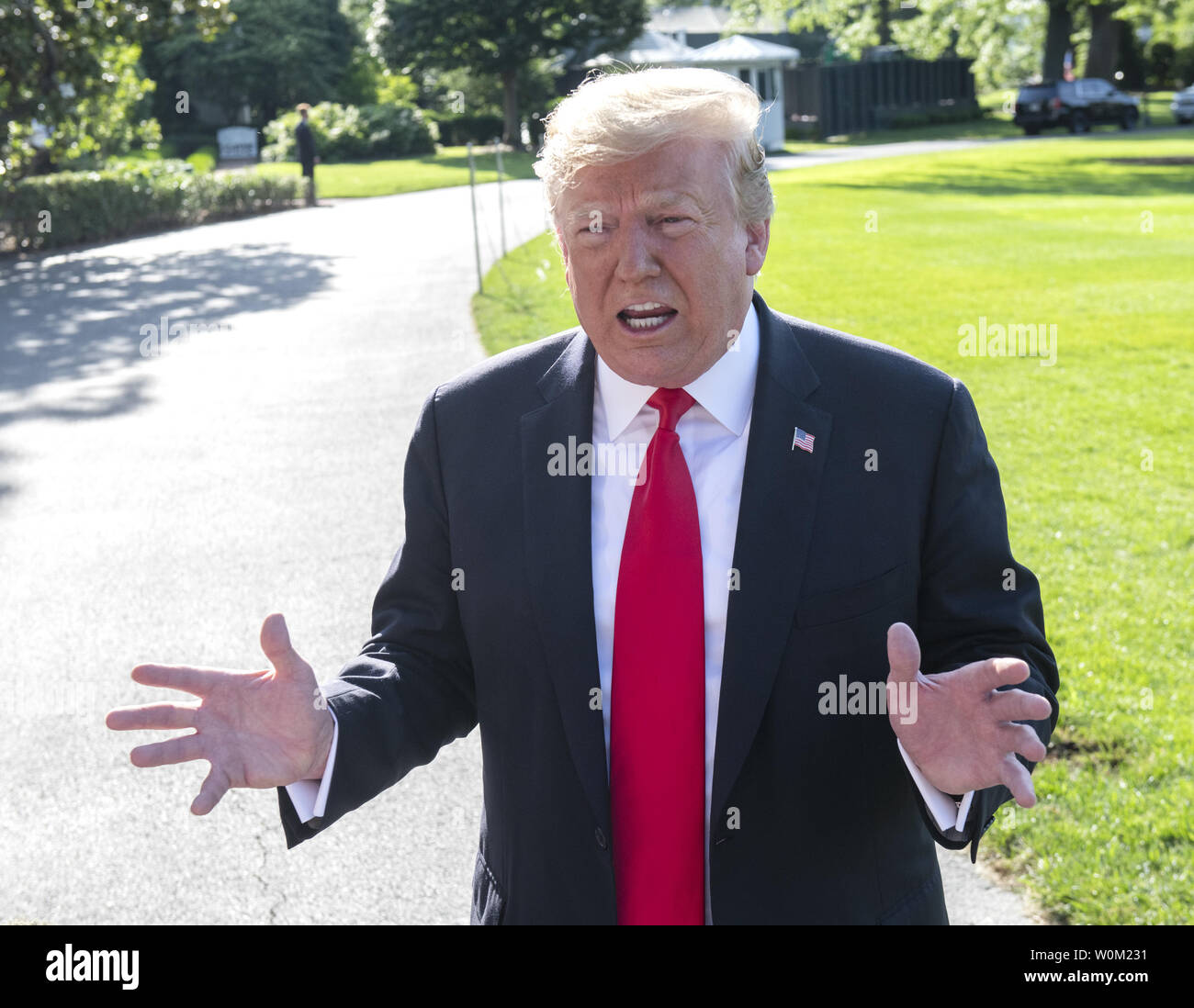 President Donald Trump reacts to a reporter's question during a press conference prior to departing via Marine One on the South Lawn of the White House in Washington, DC on May 30, 2019.   The president gave his interpretations the remarks by Robert Mueller on the probe into Russian interference in the 2016 election.  He will be in Colorado for the day.     Photo by Pat Benic/UPI Stock Photo