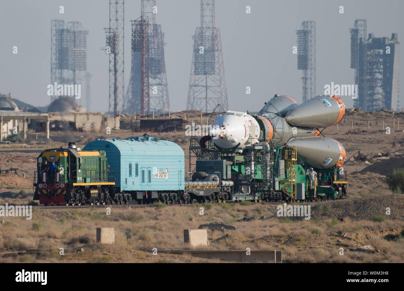 The Soyuz MS-05 spacecraft is rolled out by train to the launch pad at the Baikonur Cosmodrome, Kazakhstan, on July 26, 2017. Expedition 52 flight engineer Sergei Ryazanskiy of Roscosmos, flight engineer Randy Bresnik of NASA, and flight engineer Paolo Nespoli of ESA (European Space Agency), are scheduled to launch to the International Space Station aboard the Soyuz spacecraft from the Baikonur Cosmodrome on July 28. NASA Photo by Joel Kowsky/UPI Stock Photo