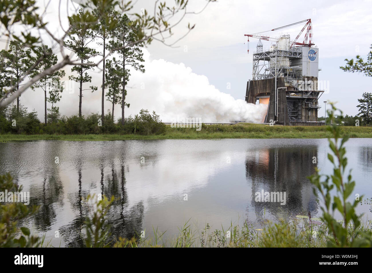 NASA engineers conducted a successful 500-second test of RS-25 flight controller for use on the new Space Launch System (SLS) deep space rocket on the A-1 Test Stand at NASA's Stennis Space Center near Bay St. Louis, Mississippi, on July 25, 2017. The test involved installing the controller unit on an RS-25 development engine and firing it in the same manner, and for the same length of time, as needed during launch. The controller is the key modification to the engines and is characterized as the 'brain' that provides precision control of engine operation and internal health diagnostics, and a Stock Photo
