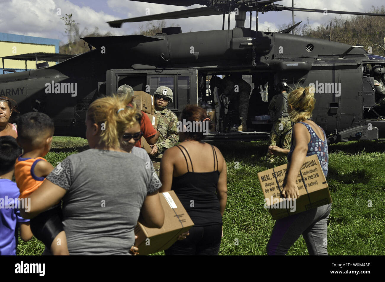 Soldiers with 6th Battalion, 101st General Support Battalion, 101st Combat Aviation Brigade, 101st Airborne Division (Air Assault) deliver food and water on October 3, 2016 to Orocovis, Puerto Rico. The Soldiers are supporting the relief efforts in Puerto Rico after the devastating effects of Hurricane Maria. Photo by Sgt. Marcus Floyd/U.S. Army/UPI Stock Photo