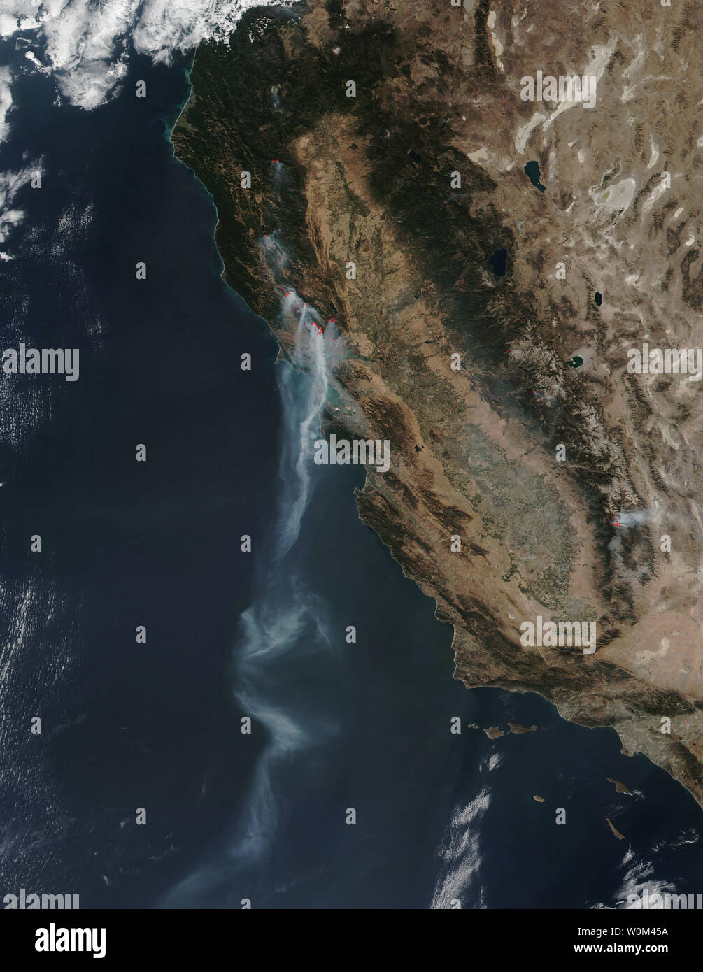 NASA's Suomi NPP satellite's Visible Infrared Imaging Radiometer Suite (VIIRS) instrument captured a stream of smoke that extended over 500 miles from various fires raging in northern California out over the Eastern Pacific Ocean on October 12, 2017. The Moderate Resolution Imaging Spectroradiometer or MODIS instrument showed the stream of smoke extending from Santa Rosa, California, located north of San Francisco, out into the Eastern Pacific, parallel to San Diego, a stream that stretched over 550 miles. The CAL Fire website noted in the California Statewide Fire Summary of Friday, October 1 Stock Photo