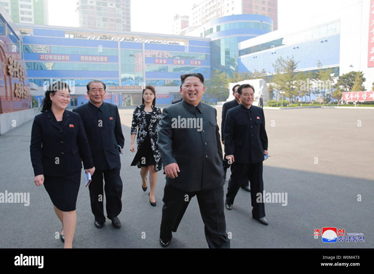 This image released on October 29, 2017, by the North Korean Official News Service (KCNA), shows North Korean leader Kim Jong Un and his wife, Ri Sol Ju, visiting a cosmetics factory in Pyongyang. During his tour of the facilities, Kim expressed his delight at the quality of the goods being produced, noting that he believed it had become 'possible to have the dream of women who want to be fairer realized. I am very pleasant to picture our women and other people who would be delighted at world-level cosmetics produced at the factory which has been put on a modern, scientific and industrial basi Stock Photo