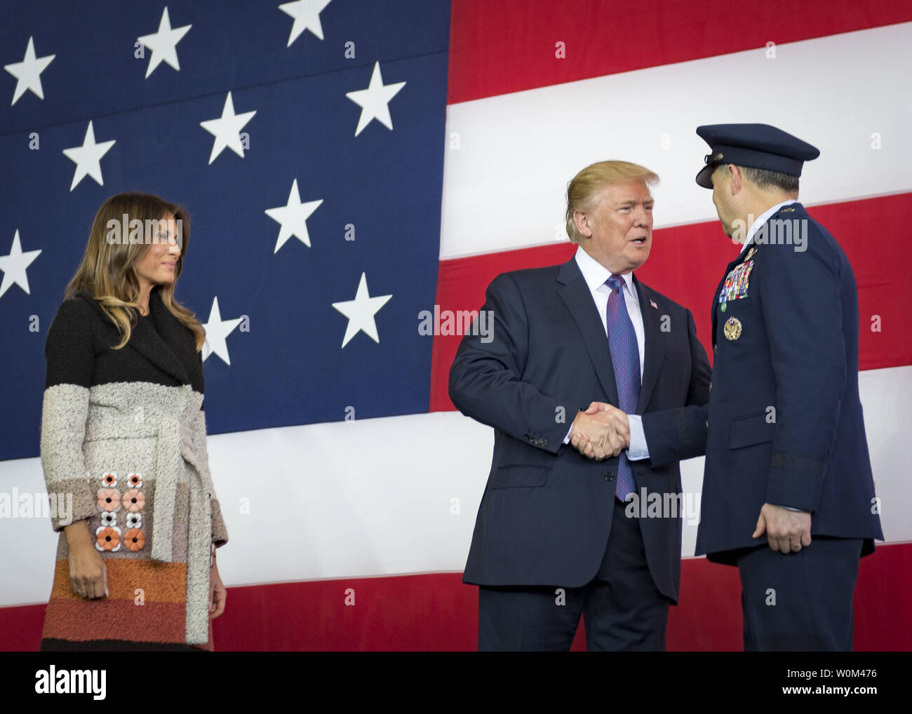 President Donald J. Trump, accompanied by his wife Melania, greets Lt. Gen. Jerry P. Martinez, U.S. Forces Japan and 5th Air Force commander, during a Troop Talk, on November 5, 2017, at Yokota Air Base, Japan. During his talk, Trump highlighted the importance of the U.S.-Japan alliance in the Indo-Asia Pacific region. Photo by A1C Juan Torres/U.S. Air Force/UPI Stock Photo