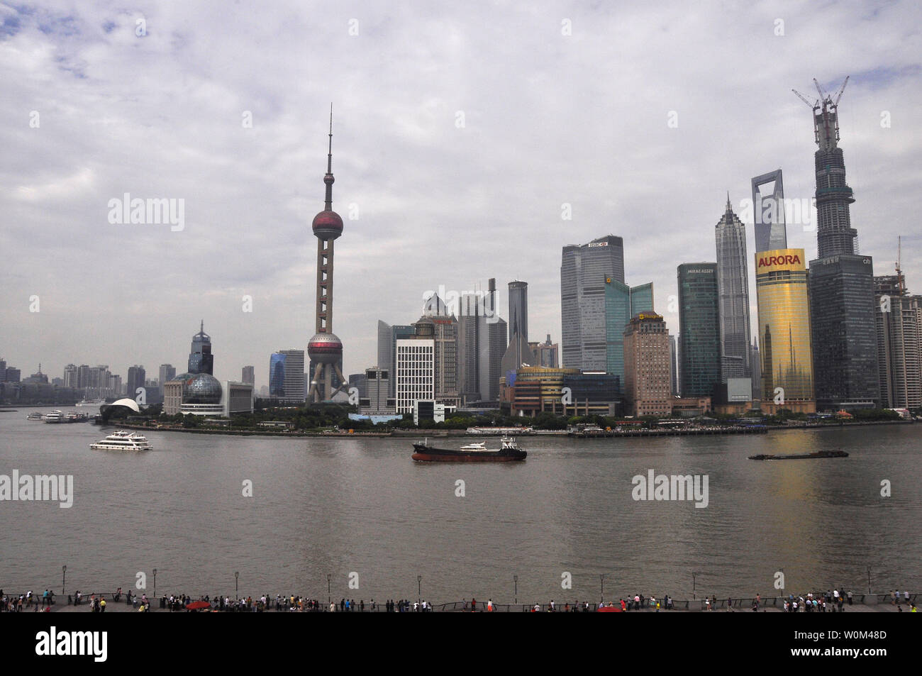 Boat travels up the Huangpu river Shanghai China Stock Photo