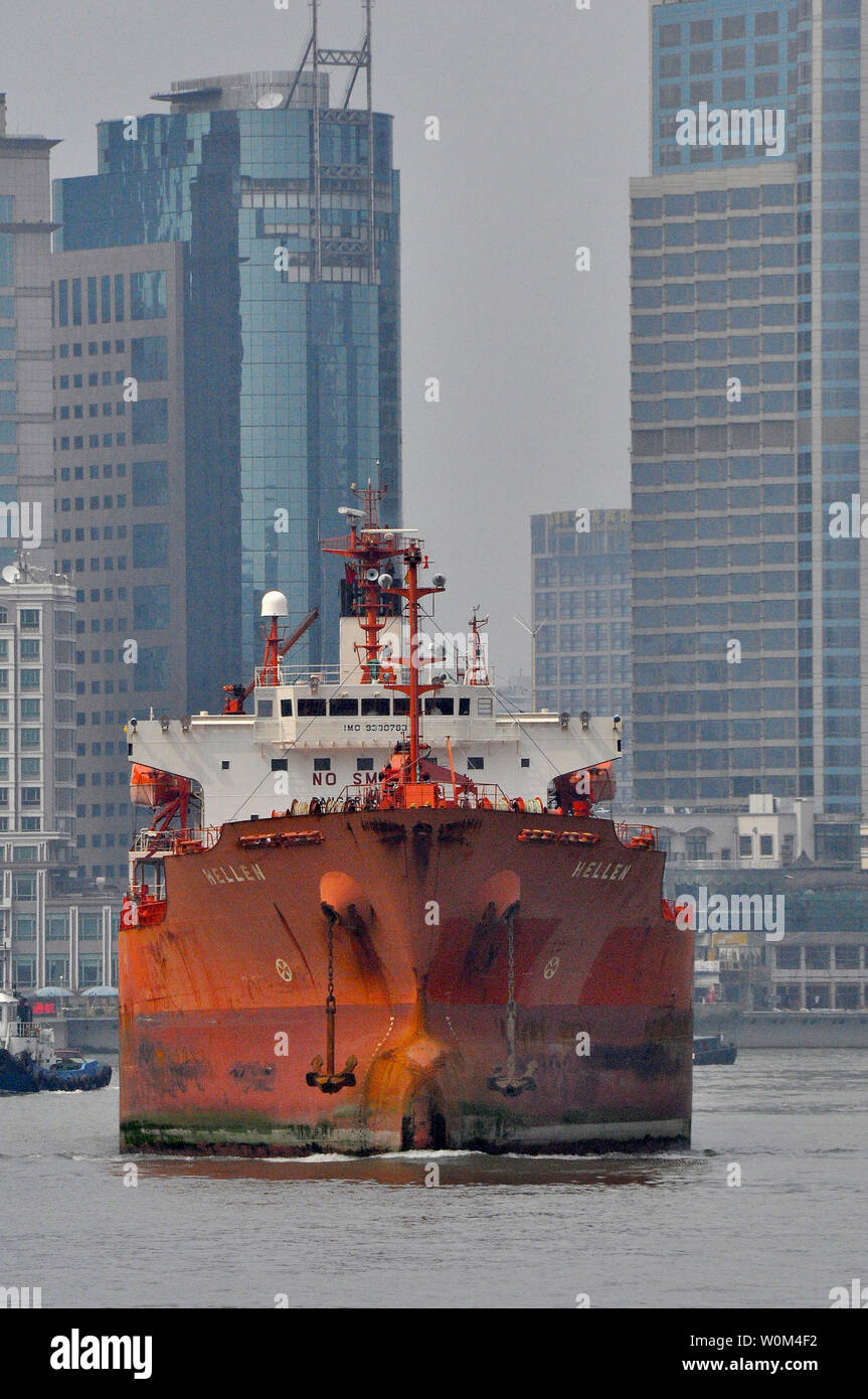 Boat travels up the Huangpu river Shanghai China Stock Photo