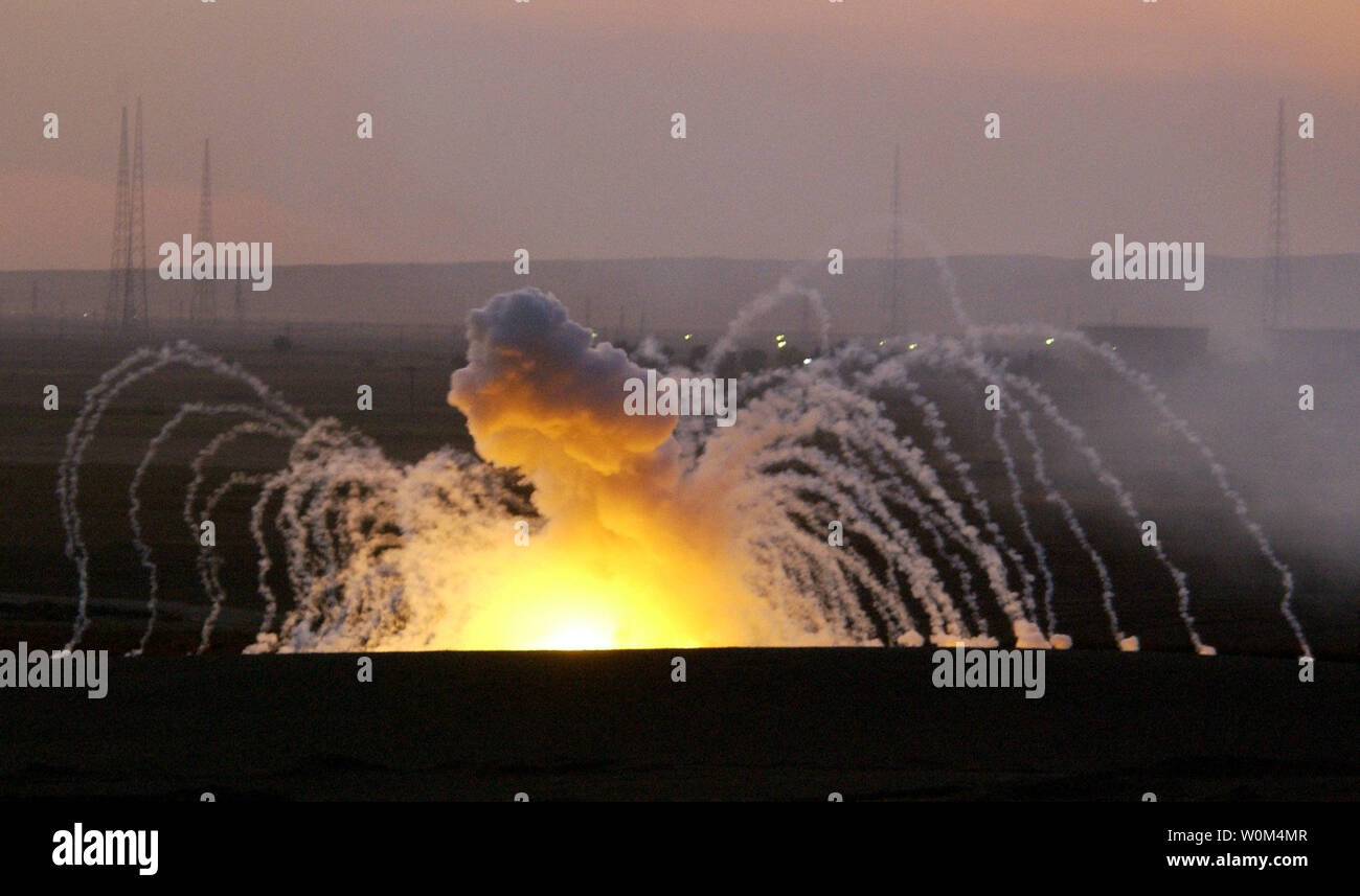 A strategic target in Kirkuk, Iraq, is bombarded by a U.S. incendiary mortar as part of Operation Ivy Cyclone, a combined-arms operation designed to root out and crush insurgents in Iraq, recently.   Photo release November 24, 2003.  (UPI Photo/Jeffrey A. Wolfe/Air Force) Stock Photo