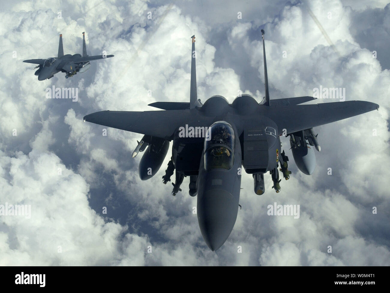 A U.S. Air Force F-15E Strike Eagles from Mountain Home Air Force Base, Idaho, soars over Iraq on December 18, 2003 in support of the Iraqi conflict.  The F-15E Strike Eagle is a dual-role fighter designed to perform air-to-air and air-to-ground missions.  An array of avionics and electronics systems gives the F-15E the capability to fight at low altitude, day or night, and in inclement weather and perform its primary function as an air-to-ground attack aircraft.  (UPI Photo/Suzanne Jenkins/Air Force) Stock Photo