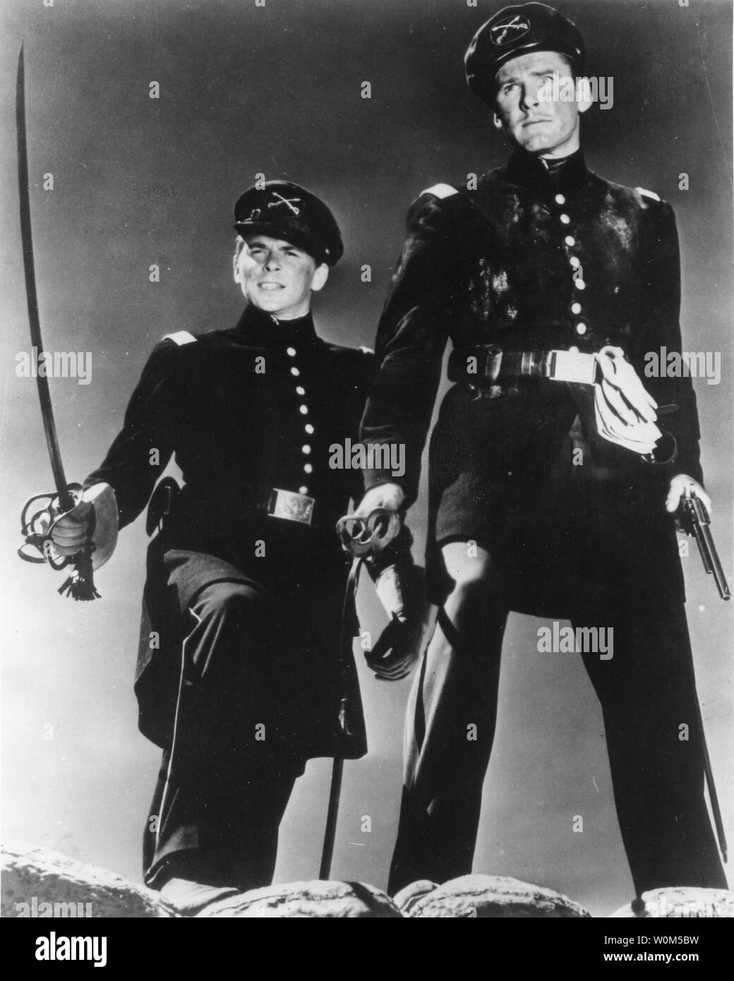 Ronald Reagan (L) is George Armstrong Custer and Errol Flynn is Jeb Stuart in this promotional still from the 1940 movie 'Santa Fe Trail.' Reagan, the 40th President of the United States of America, was instrumental in bringing about the collapse of communism and an end to the Cold War. The former President is now 92 and has been suffering from alzheimer's for over ten years. (UPI/File) Stock Photo