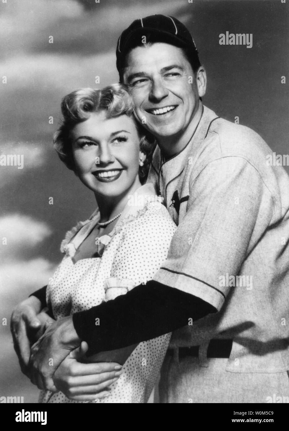 President Ronald Reagan is seen here during his years as an actor with co-star Doris Day in the 1952 movie, 'The Winning Team', about baseball great Grover Cleveland Alexander. Reagan, the 40th President of the United States of America, was instrumental in bringing about the collapse of communism and an end to the Cold War. The former President is now 92 and has been suffering from alzheimer's for over ten years. (UPI/File) Stock Photo