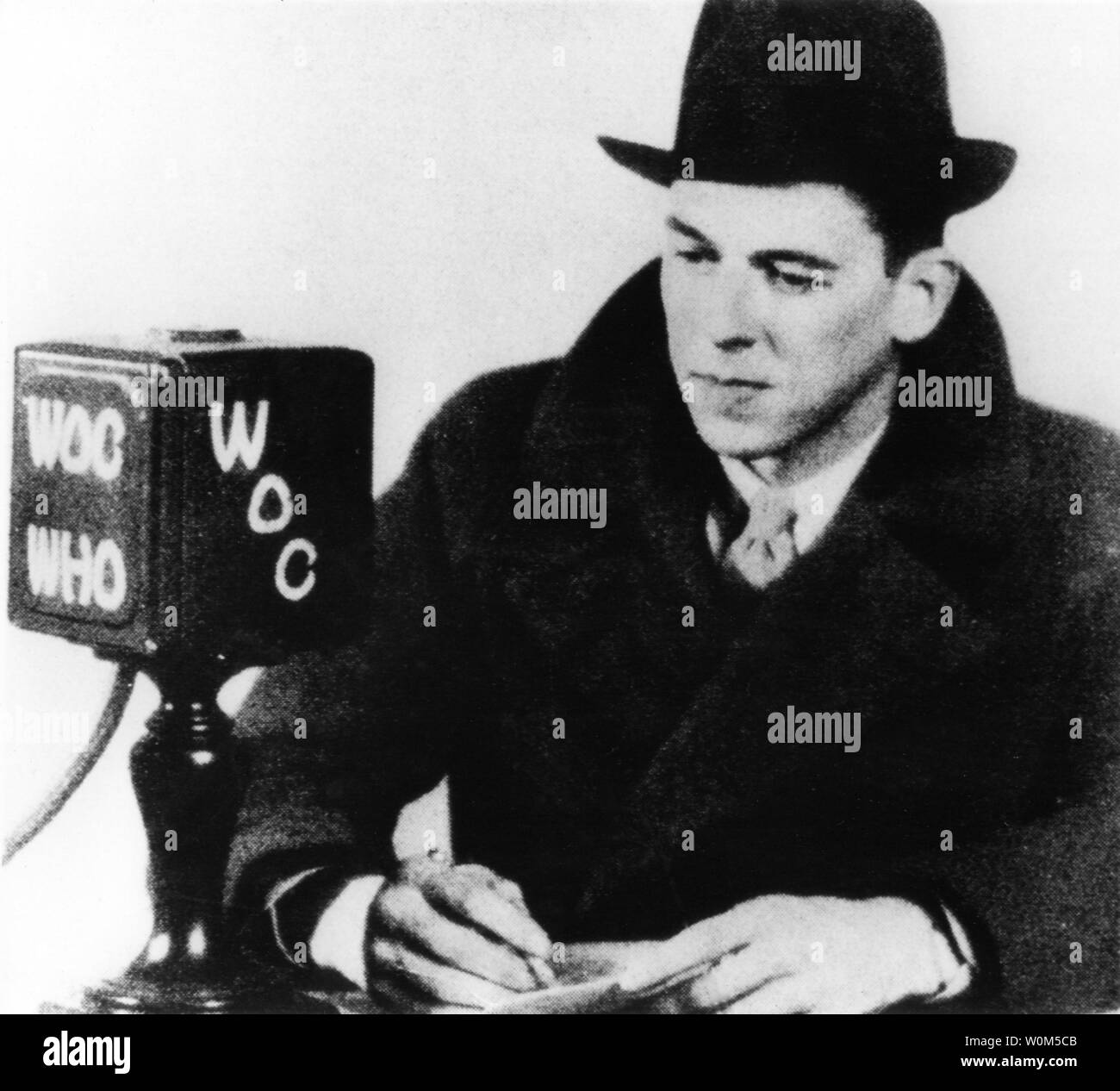 After finishing his education at Eureka College, Ronald Reagan began his career as a sports broadcaster on WHO Radio in Des Moines, Iowa. He is seen here in this file photo taken in the mid-1930's. There he would broadcast Chicago Cubs' ball games based on telegraph reports from Wrigley Field. Reagan, the 40th President of the United States of America, was instrumental in bringing about the collapse of communism and an end to the Cold War. The former President is now 92 and has been suffering from alzheimer's for over ten years. (UPI/File) Stock Photo