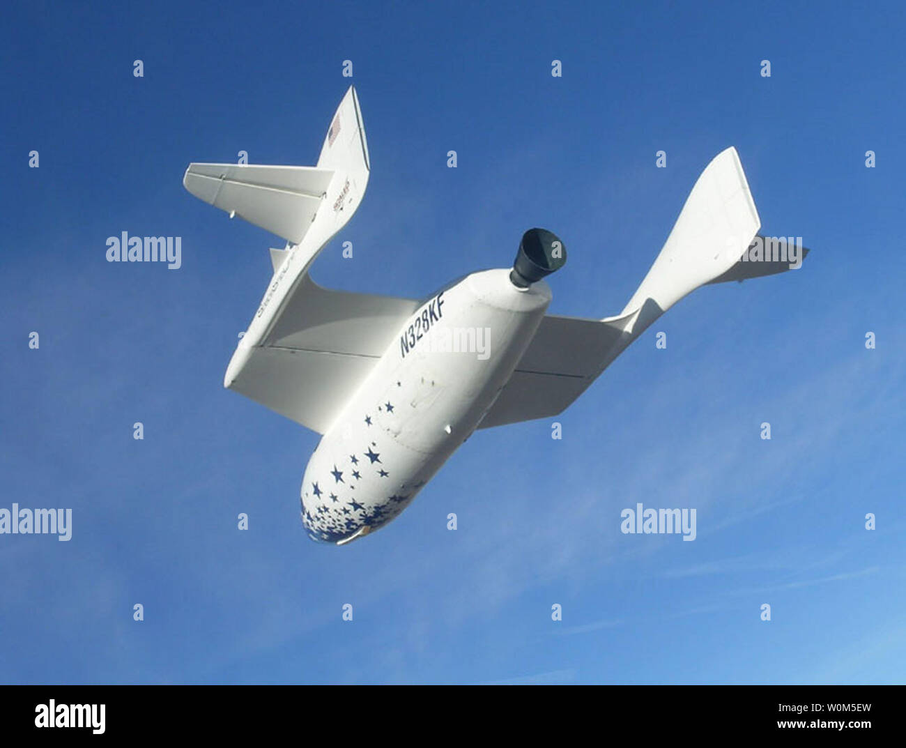 SpaceShipOne glides down for approach to the Mojave airport. The craft, which aims to rise more than 100 kilometers above the earth's surface traveling at more than three times the speed of sound, was dreamed up by Burt Rutan, 61, a US engineer who had already worked on "Voyager," which in 1986 became the first plane to fly around the world without stopping or refueling. San Diego is at left, Santa Barbara is under the left wing and Edwards Air Force Base is at lower/center.   (UPI Photo) Stock Photo