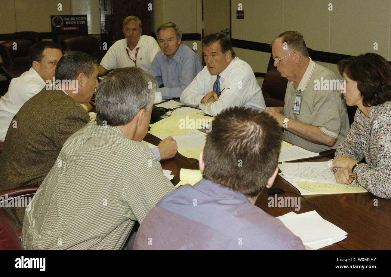 U.S. Homeland Security Secretary Tom Ridge meets with his senior leadership on August 1, 2004 prior to press conference where he warned of possible terrorist attacks in New York and Washington. (L-R): Robert Stephan, Senior Advisor; Asa Hutchinson, Under Secretary for Border and Transportation Security; Tom Ridge, Secretary; Admiral James Loy, Deputy Secretary; and Susan Neely, Assistant Secretary for Public Affairs.   (UPI Photo/Barry Bahler/DHS) Stock Photo