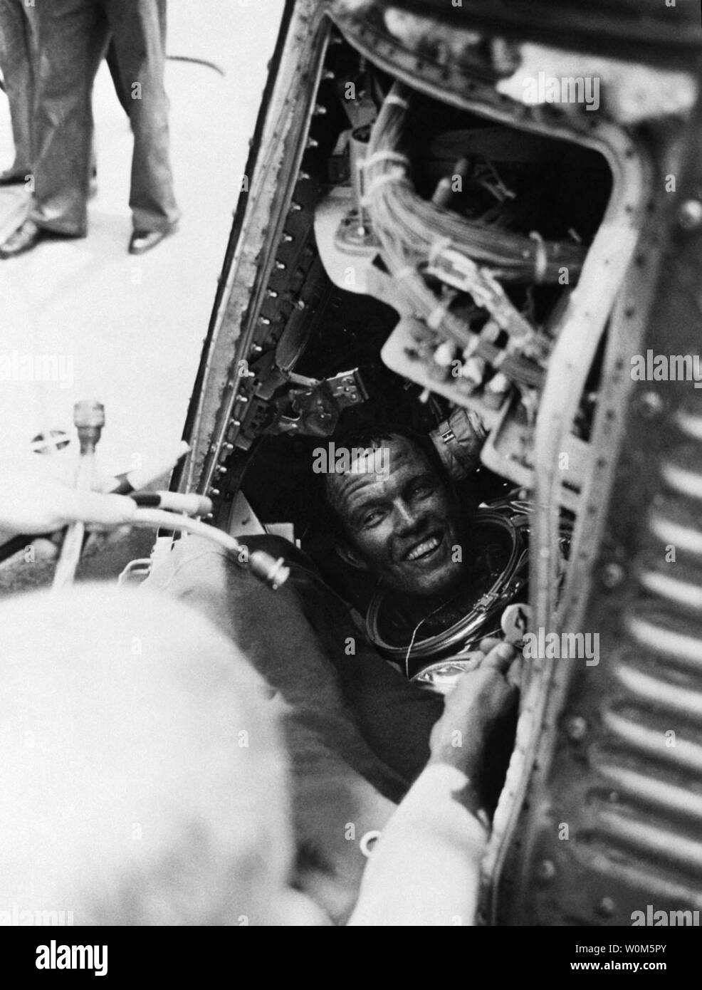 Gordon Cooper Jr., one of America's first seven astronauts, died on October 4, 2004 at his home in Ventura, Calif. He was 77 years old.  Cooper piloted the sixth and last flight of the Mercury program and later commanded Gemini 5.   In this file photo, Cooper emerges from his Mercury capsule after the record-setting Faith 7 flight.  (UPI Photo/NASA) Stock Photo