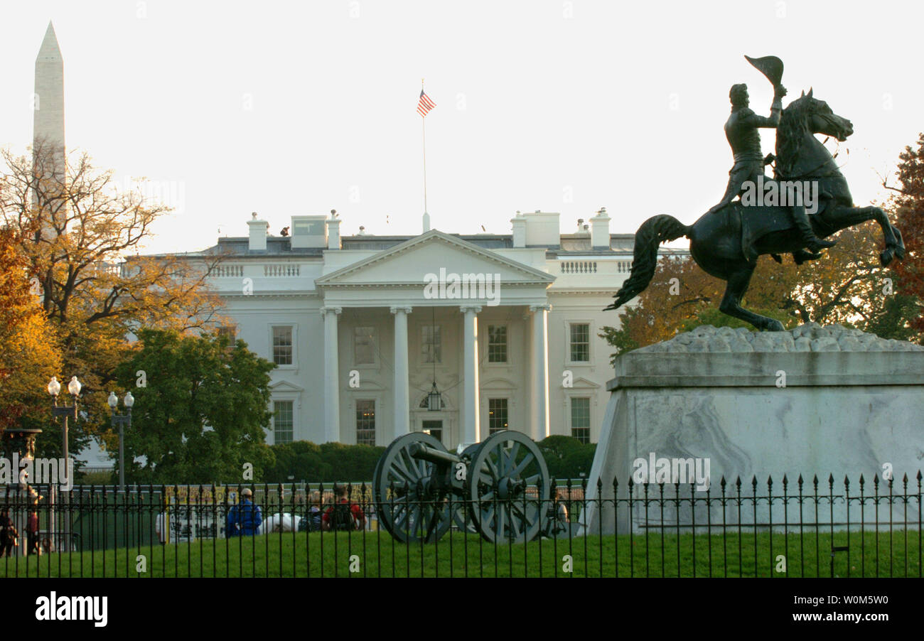 The equestrian statue of President Andrew Jackson and the Washington Monument frames the White House as the sun sets on November 2, 2004.  Republican President George W. Bush and Democratic challenger Sen. John Kerry are locked in a tight battle on election day.   The Clark Mills' stature was erected in Lafayette Park in 1853.  (UPI Photo/Pat Benic) Stock Photo