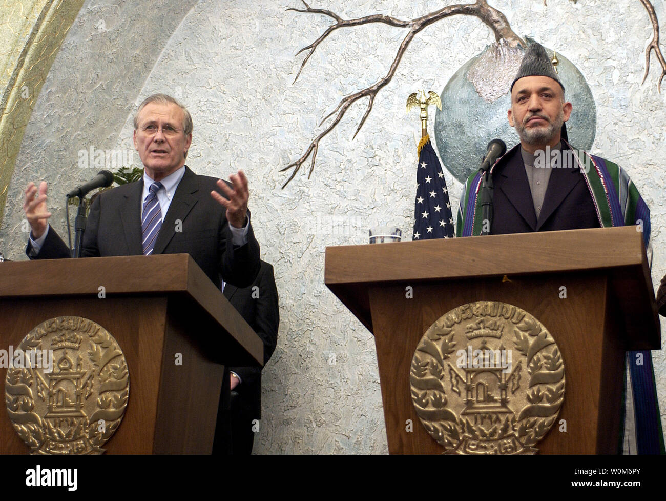 Secretary of Defense Donald H. Rumsfeld, left, and with President of Afghanistan Hamid Karzai conduct a press conference at the presidential palace in Kabul, Afghanistan on April 13, 2005.  Rumsfeld visited Afghanistan during a tour of the middle-east including visits to Kurdistan, Azerbaijan and Iraq where he met with troops and key government officials including the newly-elected members of the Iraqi government.  (UPI Photo/ Cherie A. Thurlby/Air Force) Stock Photo