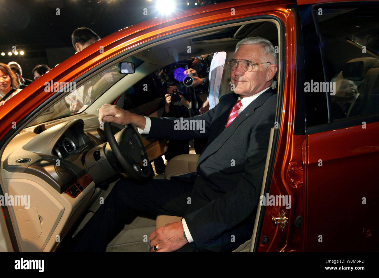 General Motors Vice Chairman Bob Lutz sits in the allnew Chevrolet Aveo at Auto Shanghai 2005