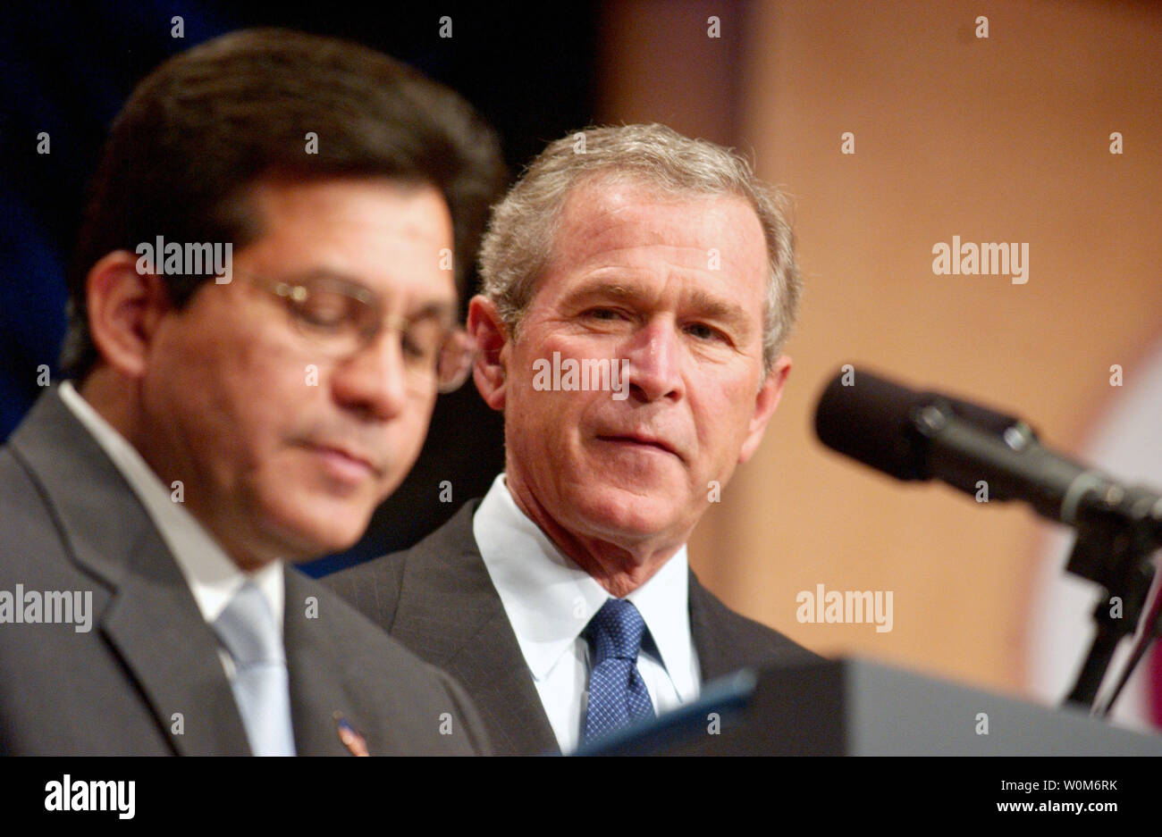 United States President George W. Bush is introduced by Attorney General Alberto Gonzales before making remarks to the United States Hispanic Chamber of Commerce Legislative Conference in Washington, D.C. on April 20, 2005.  The President called on Congress to pass his comprehensive energy plan before their August recess.   (UPI Photo/ Ron Sachs / Pool) Stock Photo
