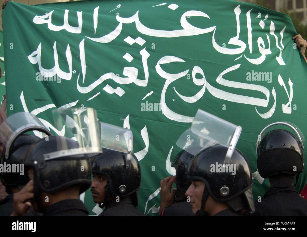 Banner Reading No Submission Except To Allah Held Up In Front Of