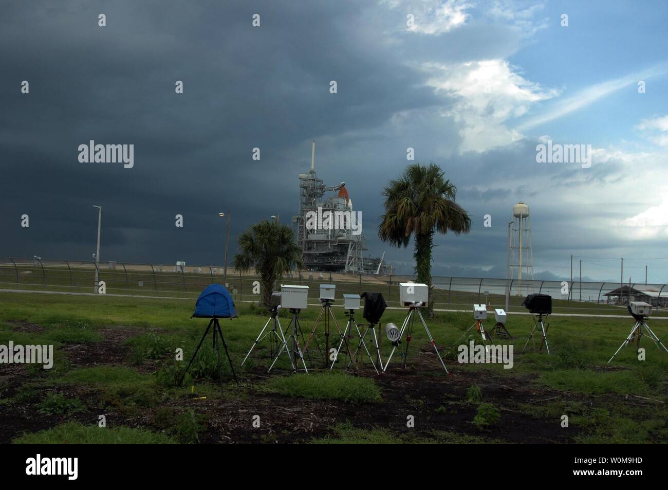Several remote cameras are positioned around the perimeter of Launch Pad 39B in preparation for the launch of mission STS-115 aboard Space Shuttle Atlantis. A lightning strike to the pad's lightning protection system on August 25, caused the mission management team to postpone the launch of mission STS-115 for 24 hours in order to review all electrical systems on the space shuttle and ground support equipment at the pad. (UPI Photo/NASA/Ken Thornsley) Stock Photo