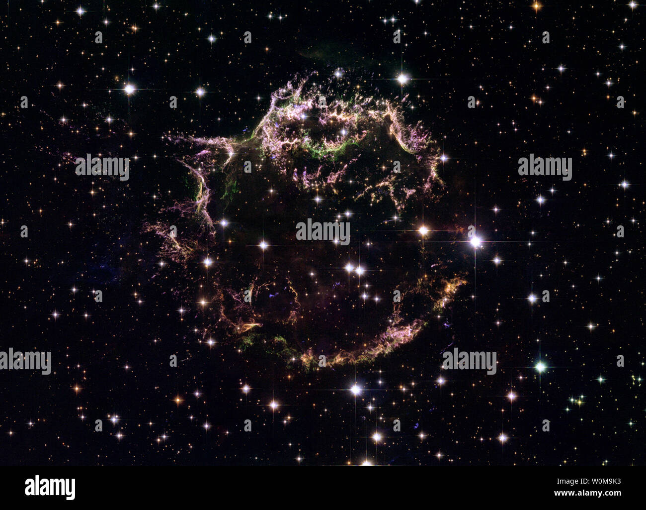 A new image taken with NASA's Hubble Space Telescope provides a detailed look at the tattered remains of a supernova explosion known as Cassiopeia A (Cas A) on August 29, 2006. It is the youngest known remnant from a supernova explosion in the Milky Way. The new Hubble image shows the complex and intricate structure of the star's shattered fragments. The image is a composite made from 18 separate images taken in December 2004 using Hubble's Advanced Camera for Surveys (ACS). (UPI Photo/NASA/ESA/HUBBLE HERITAGE) Stock Photo