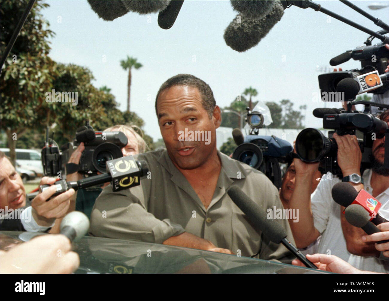O.J. Simpson (C), seen in a June 27, 1997 file photo after a debtor's hearing, was recently interviewed by the Fox TV network. During the interview, scheduled to air Nov. 27 and 29, Simpson reportedly denies murdering his ex-wife Nicole Brown Simpson and her friend Ronald Goldman, but discusses how we would have committed the murders.     (UPI Photo/Jim Ruymen/FILES) Stock Photo