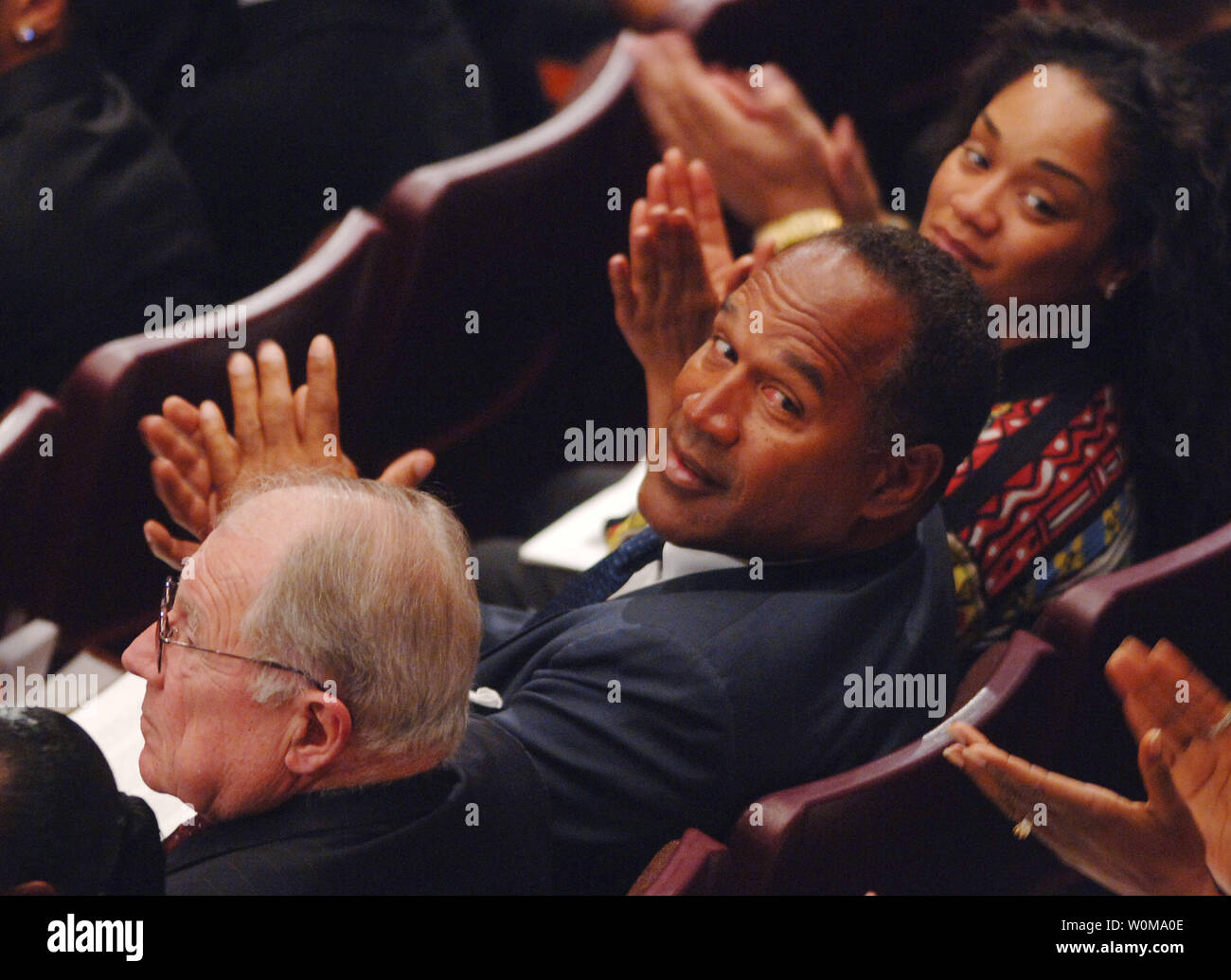 O.J. Simpson (C), seen in an  April 6, 2005 file photo during funeral services for his attorney Johnnie L. Cochran, Jr., was recently iinterviewed by the Fox TV network. During the interview, scheduled to air Nov. 27 and 29, Simpson reportedly denies murdering his ex-wife Nicole Brown Simpson and her friend Ronald Goldman, but discusses how we would have committed the murders.     (UPI Photo/Jim Ruymen/FILES) Stock Photo