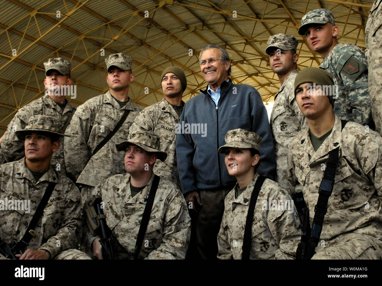 Defense Secretary Donald H. Rumsfeld meets with troops assigned to Al Asad Air Base during a surprise visit to Iraq, on December 9, 2006.  (UPI Photo/Cherie A. Thurlby/DOD) Stock Photo