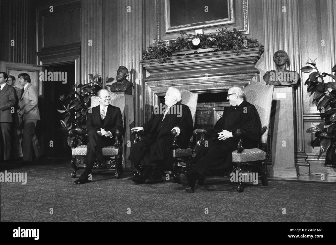 President Gerald Ford (L), shown in a December 19, 1975 file photo with Supreme Court Chief Justice Warren Burger (C) and Associate Supreme Court Justice John Paul Stevens, died at the age of 93 in his home in Rancho Mirage, California on December 26, 2006.  (UPI Photo/ David Hume Kennerly/Gerald R. Ford Library)  Description: President Ford   Date: December 19, 1975.  Credit: White House Photograph Courtesy Gerald R. Ford Library  Photographer: William Fitz-Patrick Stock Photo