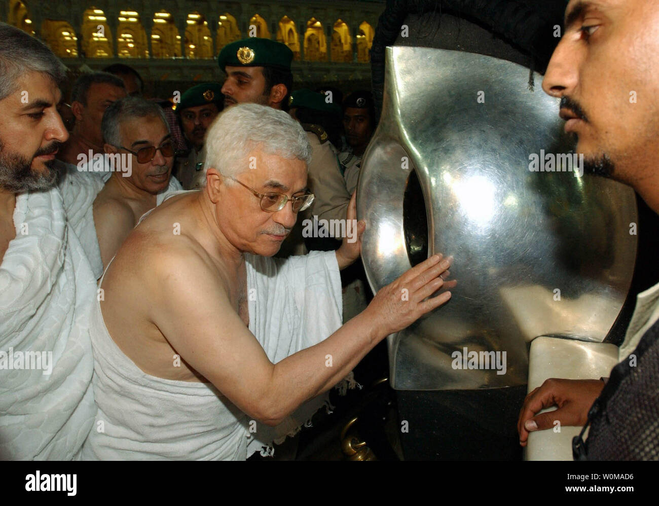 Hamas leader Khaled Meshaal (L) and Palestinian President Mahmoud Abbas stand in front of the black stone inside the Kaaba in the Grand Mosque during a pilgrimage called the Umrah, in Mecca, Saudi Arabia on February 9, 2007. Hamas and Fatah factions signed a power sharing agreement aimed at ending months of fighting.    (UPI Photo/Omar Rashidi) Stock Photo