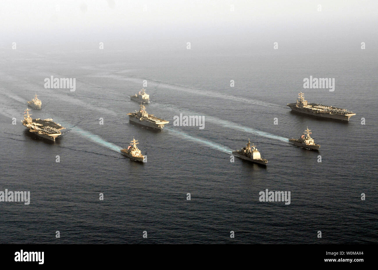 Ships assigned to the John C. Stennis Carrier Strike Group, Nimitz Carrier Strike Group, and the Bonhomme Richard Expeditionary Strike Group steam through the Gulf of Oman on May 22, 2007. The three strike groups support Maritime operations set the conditions for security and stability, as well as complement counter-terrorism and security efforts to regional nations. This group is the largest daytime assembly of U.S. warships in the Gulf since the 2003 and will hold drills off Iran's coast in a U.S. show of force to reassure Gulf security to regional allies. (UPI Photo/Denny Cantrell/U.S. Navy Stock Photo