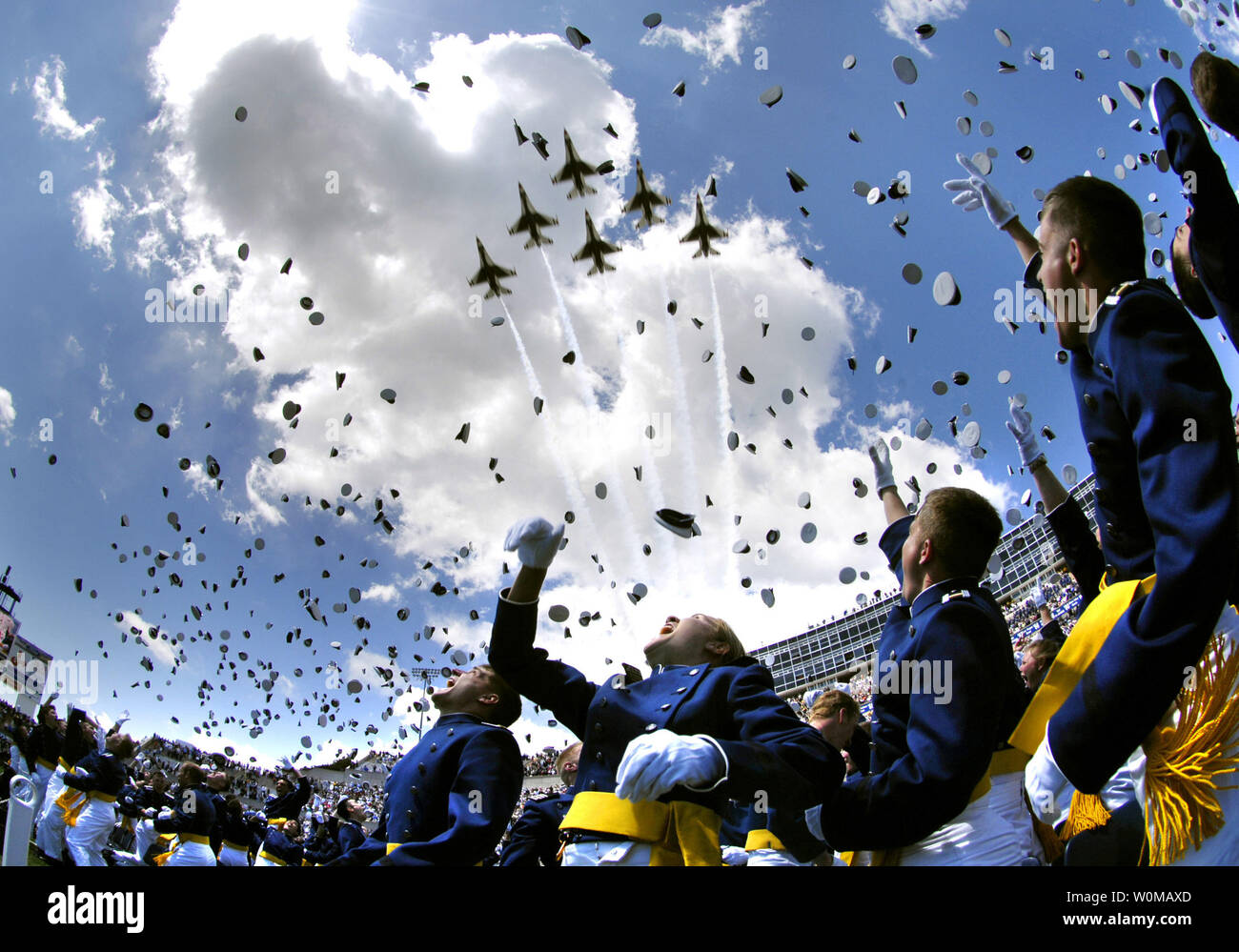 U.S. Air Force Academy graduates throw their hats in the air in celebration as the Thunderbirds fly overhead signaling the end of the Air Force Academy graduation ceremony in Colorado Springs, Colorado on May 30, 2007.  Secretary of Defense Robert M. Gates delivered the commencement address to the 976-member graduating class.  (UPI Photo/Cherie A. Thurlby/Dept. of Defense) Stock Photo