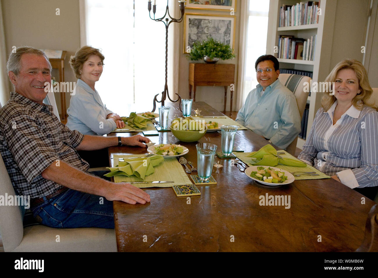 President George W. Bush and Mrs. Laura Bush sit with U.S. Attorney General Alberto Gonzales and his wife, Rebecca, during a visit August  26, 2007, at the Bush Ranch in Crawford, Texas. The Attorney General's resignation was announced Monday morning. In a statement, the President said, 'Al Gonzales is a man of integrity, decency and principle. And I have reluctantly accepted his resignation, with great appreciation for the service that he has provided for our country.'   (UPI Photo/Chris Greenberg/White House) Stock Photo