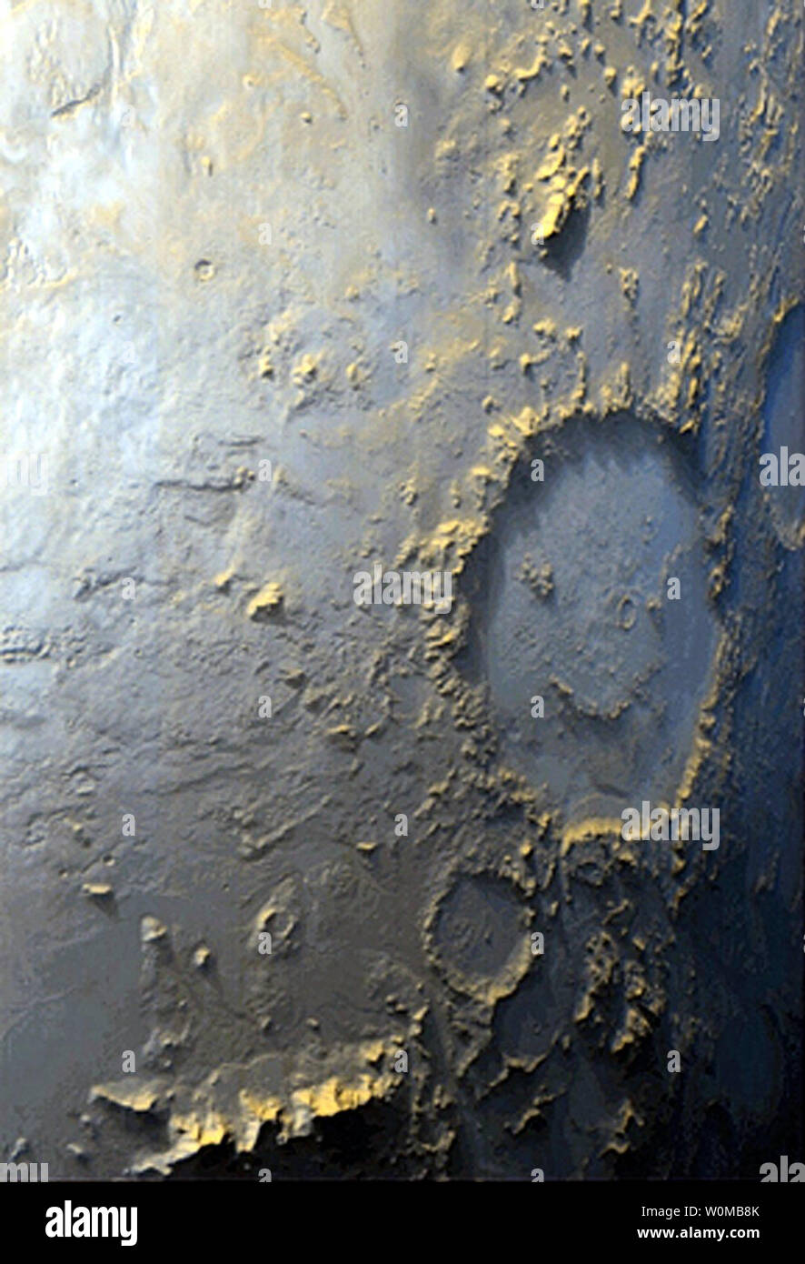 What scientists call the 'Happy Face' on the surface of Mars is pictured in a March 12, 1999 Mars Global Surveyor photo. This crater is officially known as Galle Crater, and it is about 215 kilometers (134 miles) across. NASA celebrates the 50th anniversary of the Space Age marked by the October 4, 1957 launch of Sputnik, the world's first artificial satellite, made by the Soviet Union. (UPI Photo/NASA/FILES) Stock Photo