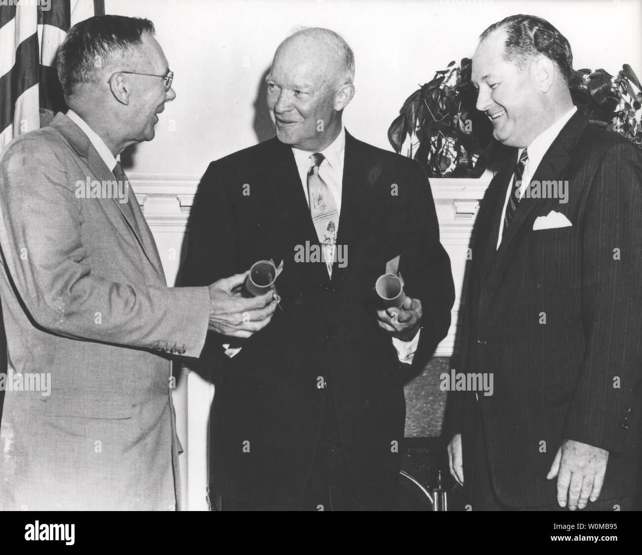 President Dwight D. Eisenhower (C) commissions Dr. T. Keith Glennan (R) as NASA Administrator and Dr. Hugh L. Dryden as NASA Deputy Administrator in Washington on July 29, 1958.  NASA celebrates the 50th anniversary of the Space Age marked by the October 4, 1957 launch of Sputnik, the world's first artificial satellite, made by the Soviet Union. (UPI Photo/NASA/FILES) Stock Photo