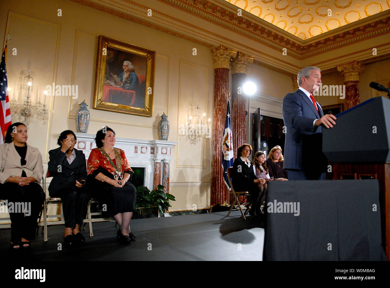 United States President George W. Bush makes remarks on Cuba Policy at the United States Department of State in Washington, D.C. on October 24, 2007.  From left to right behind the President: Damaris Garcia, Mirta Pernet,Olga Alonso,Yamile Llanes Labrada, Melissa Gonzalez, and Marlenis Gonzalez..Credit: Ron Sachs / Pool via CNP Stock Photo