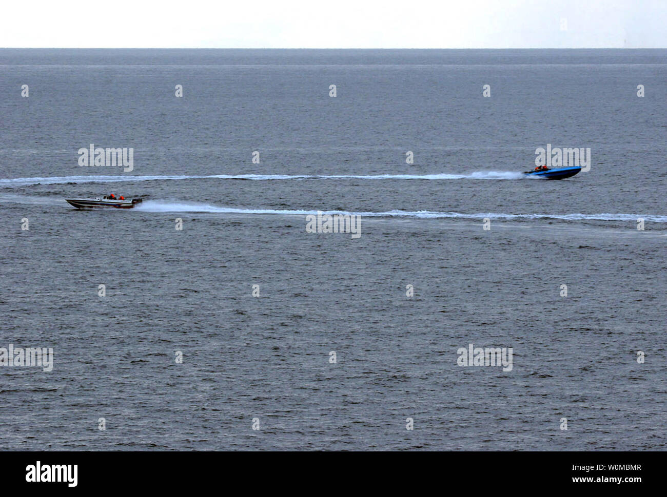 Small craft suspected to be from the Islamic Republic of Iran Revolutionary Guard Navy (IRGCN), maneuver aggressively in close proximity of the U.S. Navy Aegis-class cruiser USS Port Royal (CG 73), Aegis-class destroyer USS Hopper (DDG 70) and frigate USS Ingraham (FFG 61) in the Persian Gulf on January 6, 2008. All three ships were steaming in formation and had just completed a routine Strait of Hormuz transit. Coalition vessels, including U.S. Navy ships, routinely operate in the vicinity of both Islamic Republic of Iran Navy and IRGCN vessels and aircraft, without incident.  (UPI Photo/US N Stock Photo