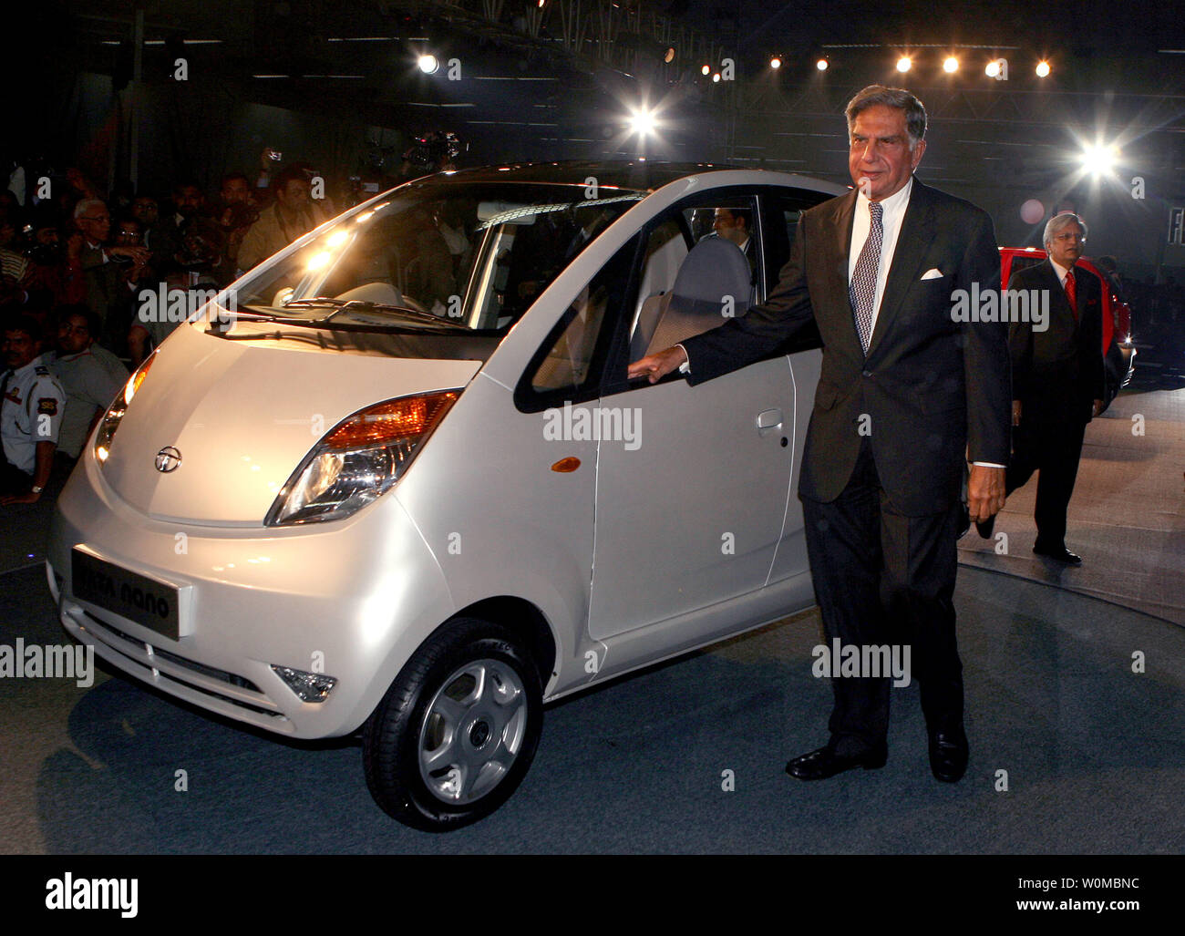 Tata Company Chairman Ratan Tata announces the newly launched Tata Nano at the 9th Auto Expo in New Delhi, India, Thursday, January 10, 2008. India's Tata Motors unveiled its much anticipated US$2,500 car, an ultracheap price tag that brings car ownership into the reach of tens of millions of people across the world. Tata claims that the Nano is the world's cheapest car.  (UPI Photo) Stock Photo