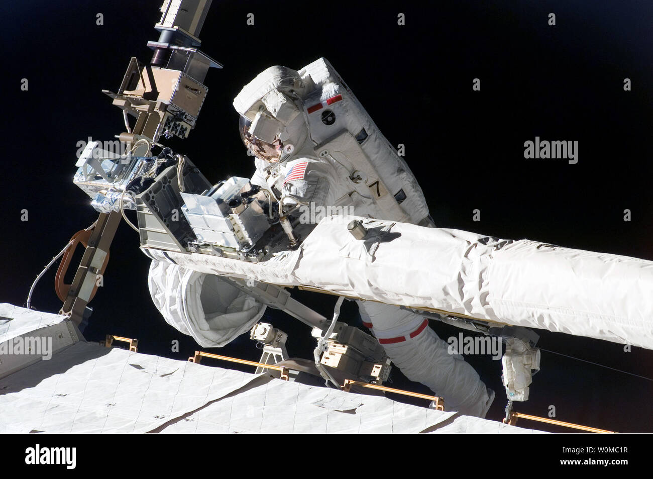 Mike Foreman Astronaut Mike Foreman, STS-123 mission specialist, helps to tie down ...