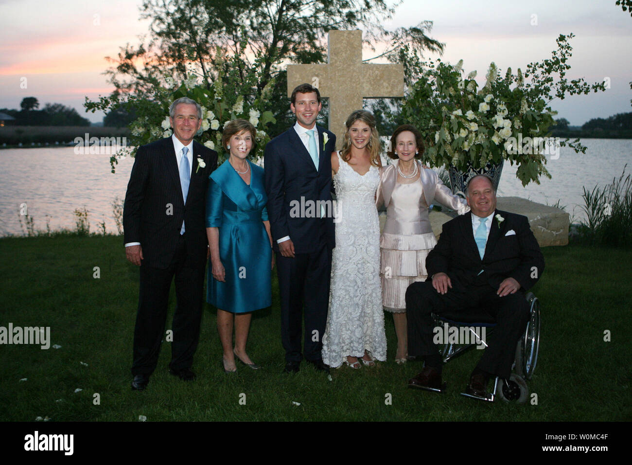 President George W. Bush and Mrs. Laura Bush and Mr. and Mrs. Hager pose with the newly married couple, Jenna and Henry Hager, in front of the altar on Prairie Chapel Ranch near Crawford, Texas on May 10, 2008.  Photo released by White House on May 11th.   (UPI Photo/White House/Shealah Craighead) Stock Photo