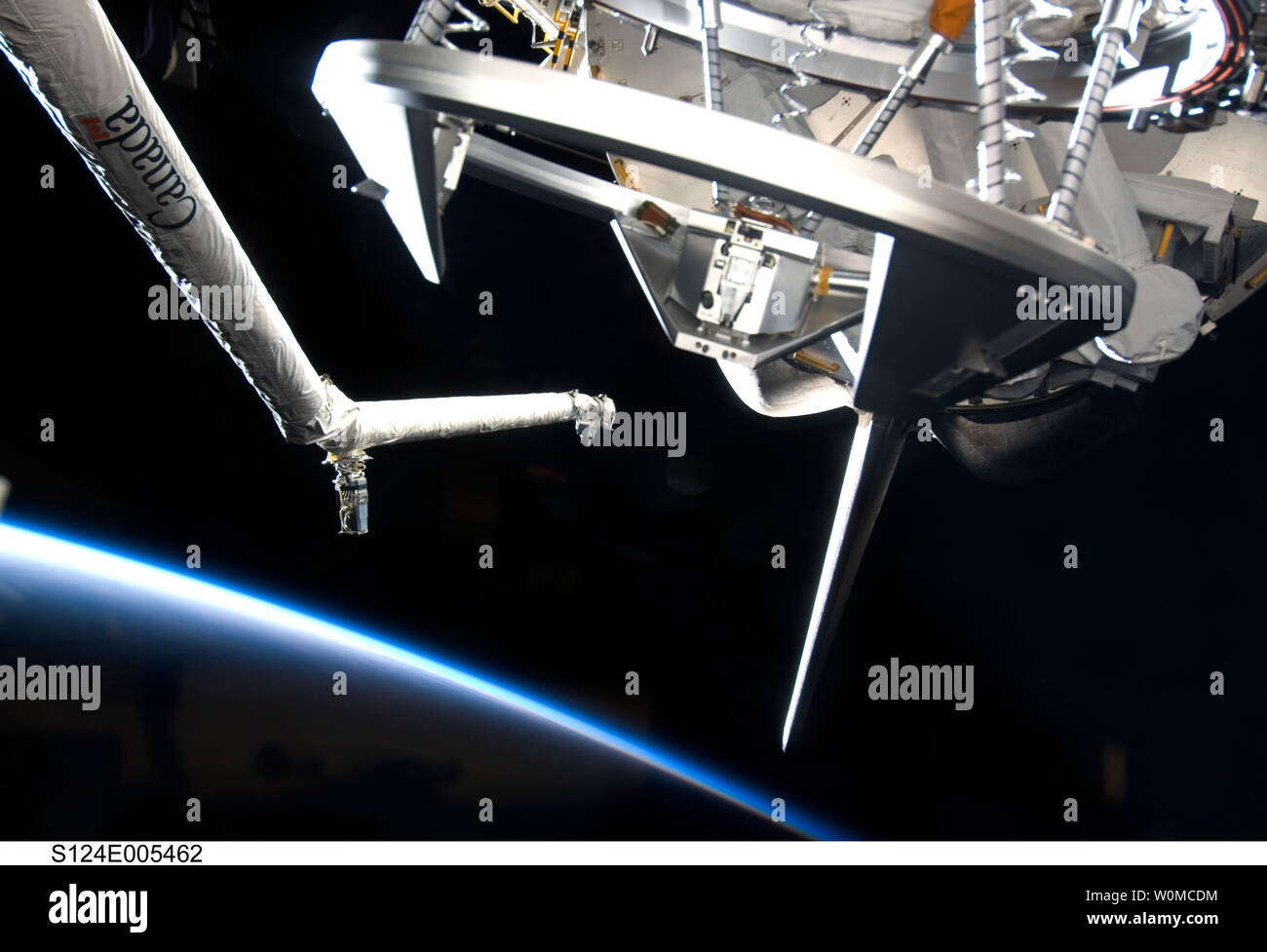 Space Shuttle Discovery's Remote Manipulator System (RMS), docking
