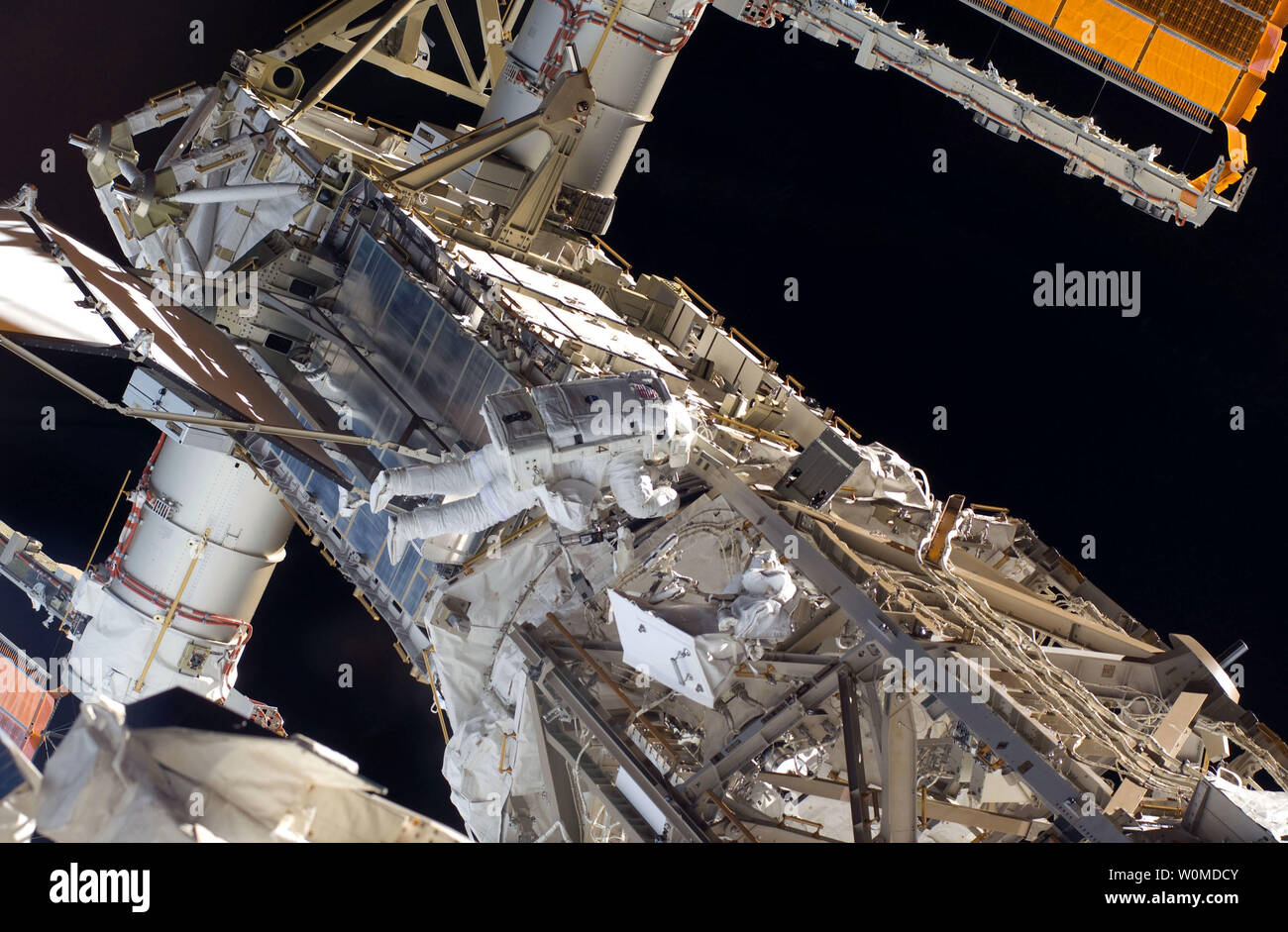 Astronaut Steve Bowen, NASA mission STS-126 specialist, participates in the mission's third scheduled session of extravehicular activity (EVA) as construction and maintenance continue on the International Space Station, on November 22, 2008. During the six-hour, 57-minute spacewalk, Bowen and astronaut Heidemarie Stefanyshyn-Piper (out of frame), mission specialist, focused their efforts on the continued cleaning of the station's starboard solar alpha rotary joint (SARJ) and the removal and replacement of trundle bearing assemblies (TBA). Bowen and Piper also cleaned the area around the SARJ's Stock Photo