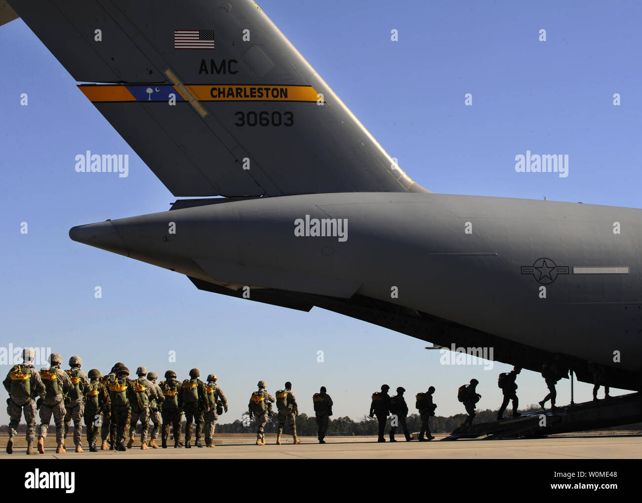U.S. Airmen of the 820th Security Forces Group and British airmen from the No. 2 Squadron, Royal Air Force Regiment board a C-17 Globemaster III aircraft prior to performing a static-line parachute jump at Moody Air Force Base in Georgia on February 5, 2009. (UPI Photo/Brittany Barker/U.S. Air Force) Stock Photo