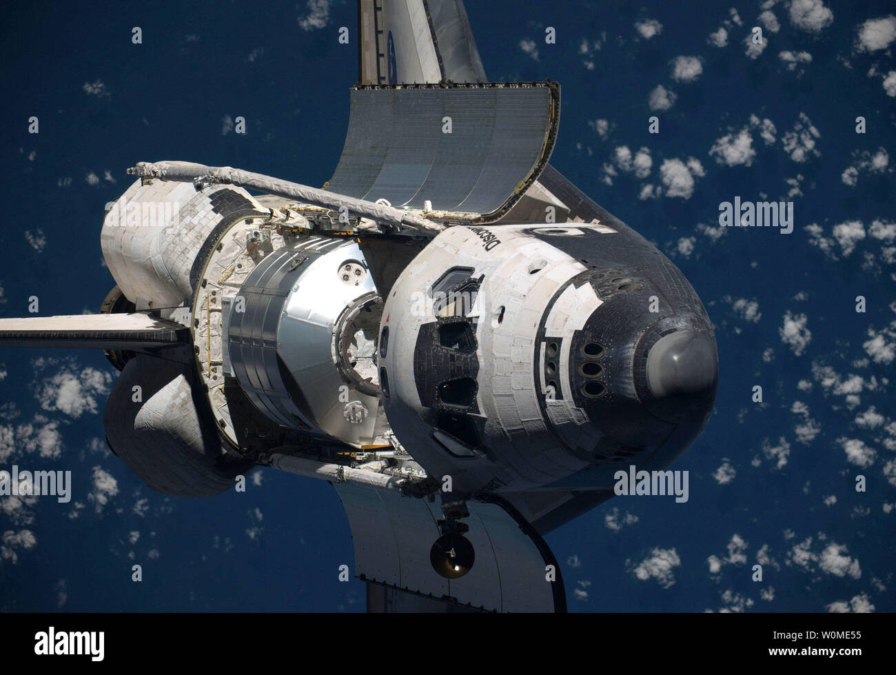 This NASA taken by crew members abroad the International Space Station  shows Space Shuttle Discovery, on mission STS-128, as it performed a full  360-degree backflip, prior to docking on August 30, 2009.