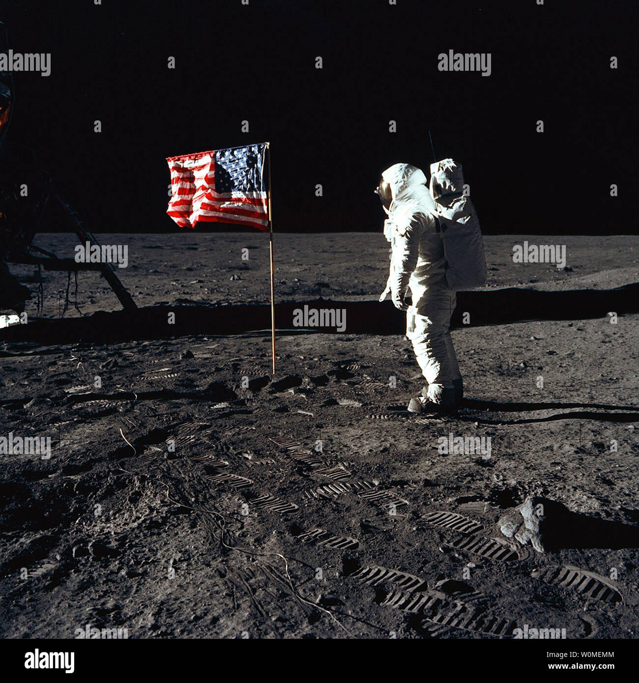 Astronaut Buzz Aldrin poses for a photograph beside the deployed United States flag during the Apollo 11 mission on the surface of the Moon on July 20, 1969. NASA marks the 40th anniversary of the Apollo 11 mission to the Moon and the historic first 'moonwalk' this year. During the eight-day space mission, Armstrong and Aldrin explored the Moon's surface and brought back rock samples for scientists to study. Collins piloted the command module in the lunar orbit during their 22-hour stay on the moon. (UPI Photo/NASA) Stock Photo
