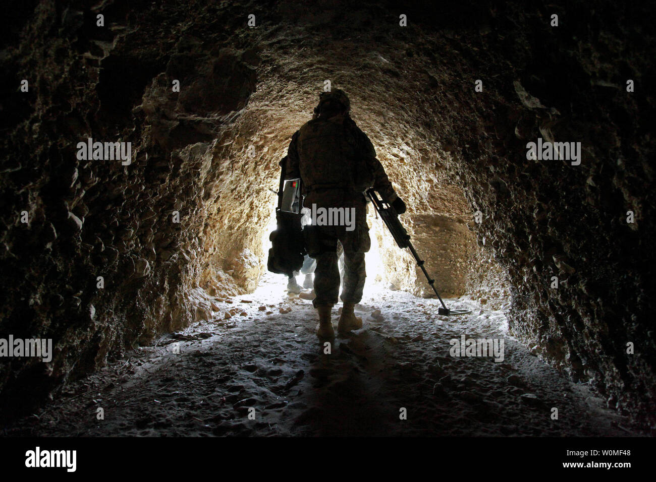 U.S. Army Spc. Jonathan Araiza uses a mine detector during a mission with Afghan national police to search for enemy weapons caches near Shah Wali Zarat, Khowst province, Afghanistan, on July 24, 2009. UPI/Andrew Smith/U.S. Army Stock Photo