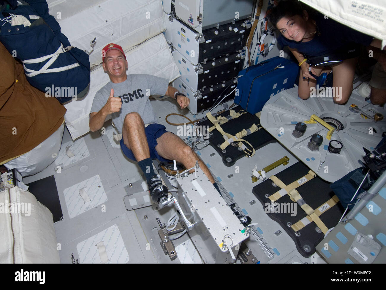 This NASA image taken by astronauts aboard Space Shuttle Discovery on mission STS-128 shows Astronaut Rick Sturckow, STS-128 commander, exercising on a bicycle ergometer on the middeck of the Earth-orbiting Space Shuttle Discovery, August 29, 2009.  UPI/NASA Stock Photo