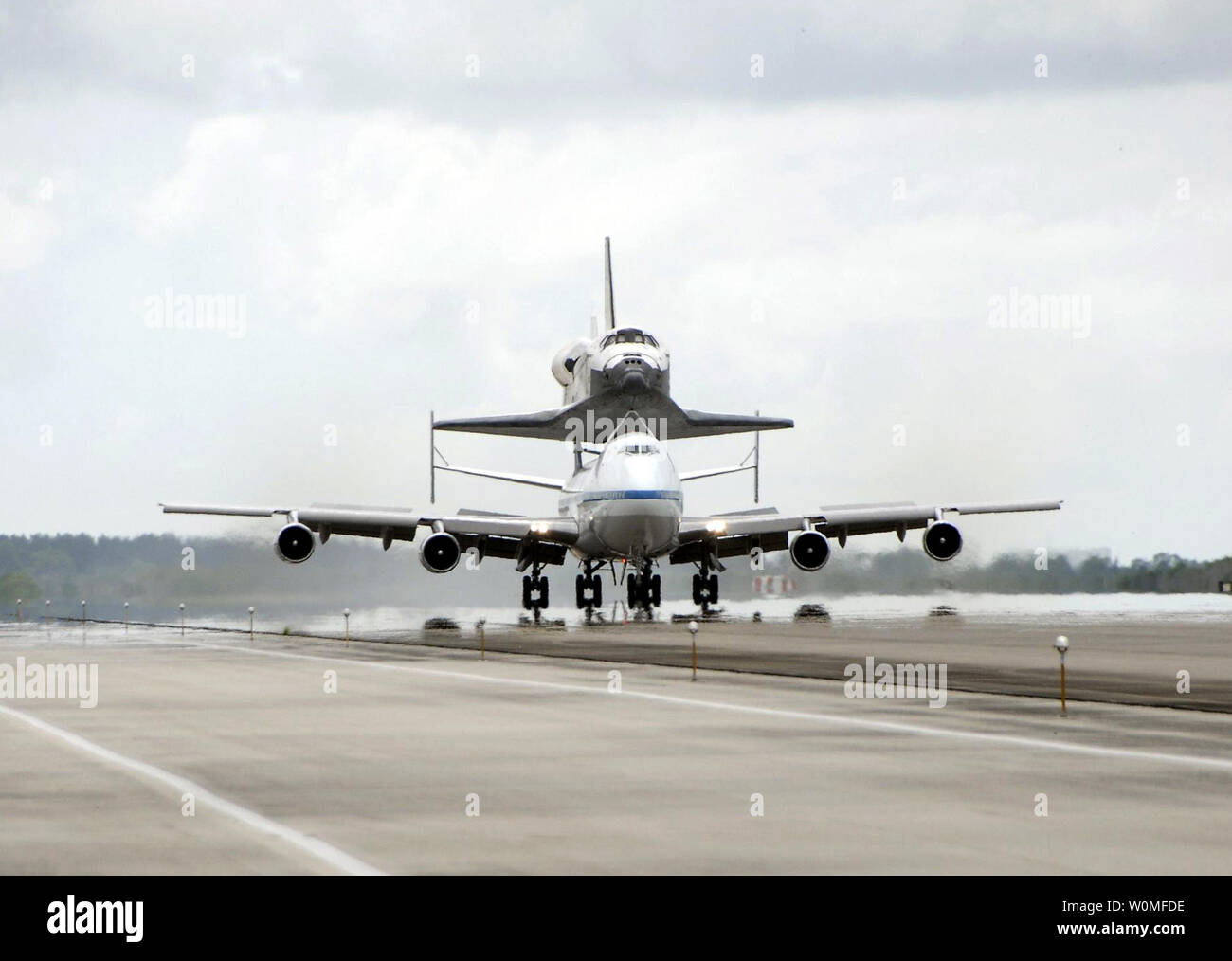 Space shuttle Discovery sits atop the Boeing 747 Shuttle Carrier Aircraft as it touched down at NASA's Kennedy Space Center in Florida on September 21, 2009. The two-day return flight from Edwards Air Force Base in California began at 9:20 a.m. EDT Sept. 20. After three fueling stops that included an overnight stay in Louisiana, the piggybacked shuttle had to navigate through a line of showers across Louisiana and around Kennedy.     UPI/NASA Stock Photo